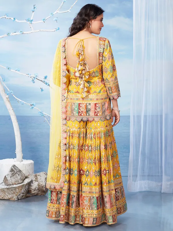 Mustard yellow georgette sharara suit for wedding