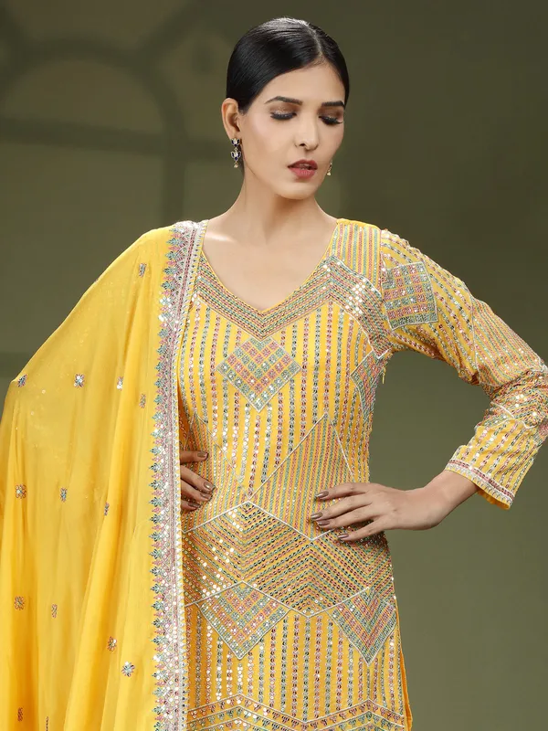 Mustard yellow georgette sharara suit with dupatta