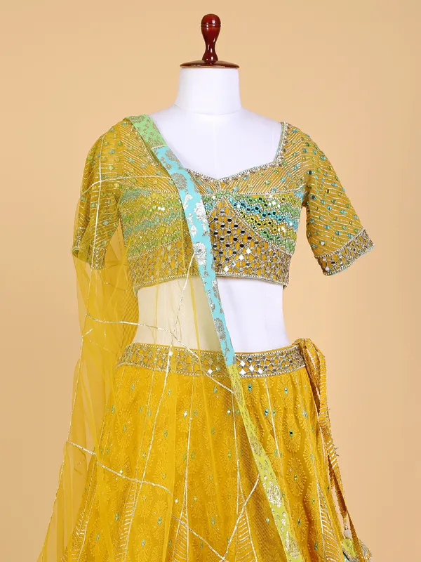 Mustard yellow lehenga choli with net dupatta