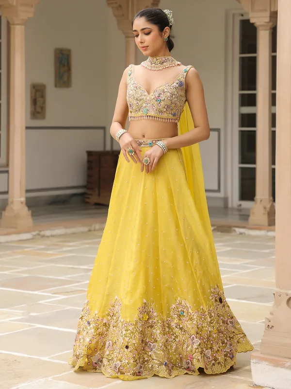 Mustard yellow organza lehenga choli with dupatta