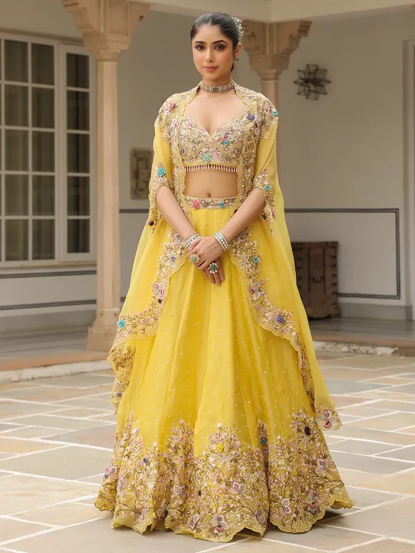 Mustard yellow organza lehenga choli with shrug