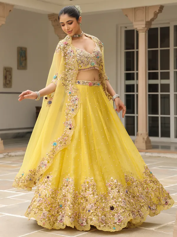 Mustard yellow organza lehenga choli with shrug