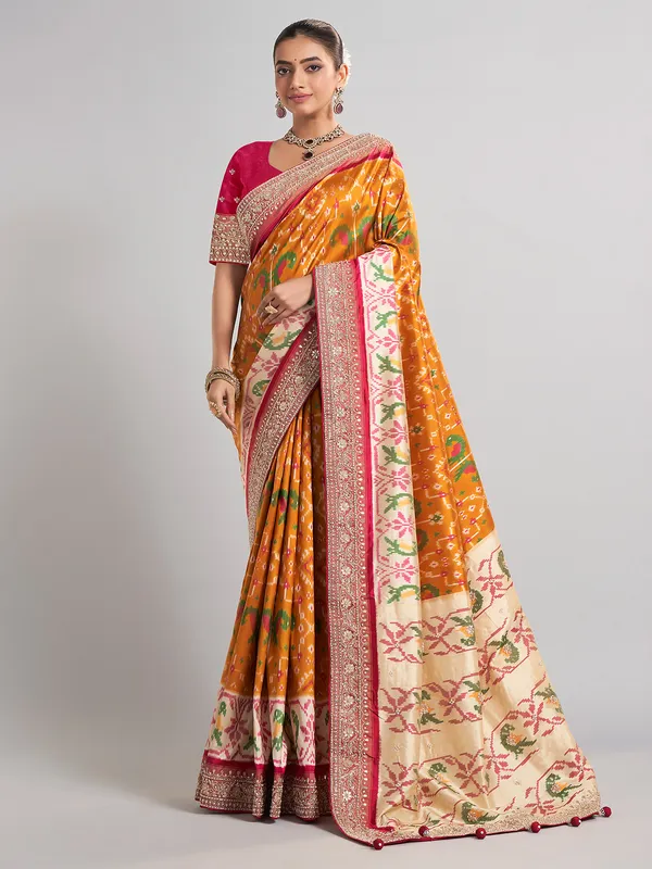 Mustard yellow patola silk saree for haldi ceremonies