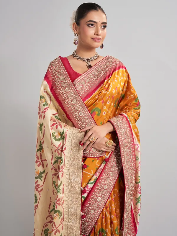 Mustard yellow patola silk saree for haldi ceremonies
