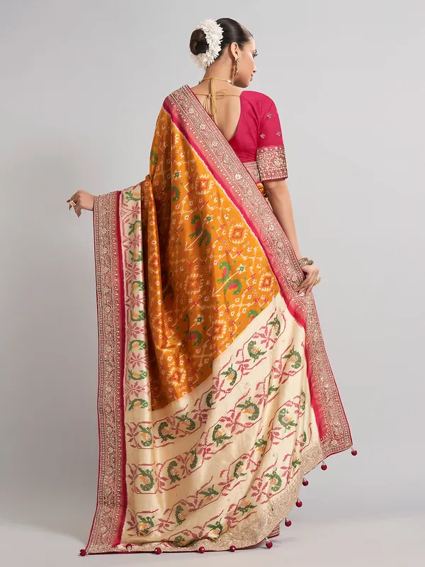 Mustard yellow patola silk saree for haldi ceremonies