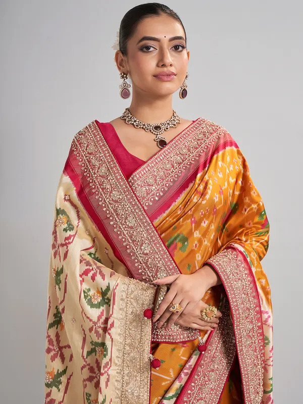 Mustard yellow patola silk saree for haldi ceremonies
