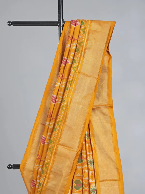Mustard yellow patola silk saree for haldi glow