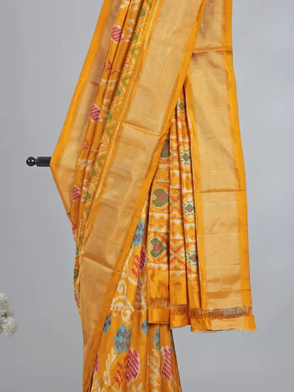 Mustard yellow patola silk saree for haldi glow