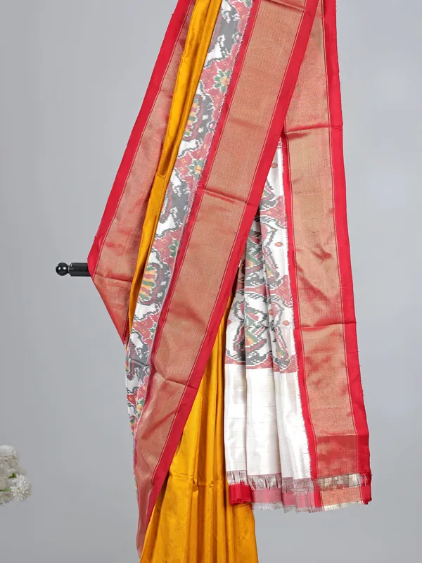 Mustard yellow patola silk saree for wedding wear