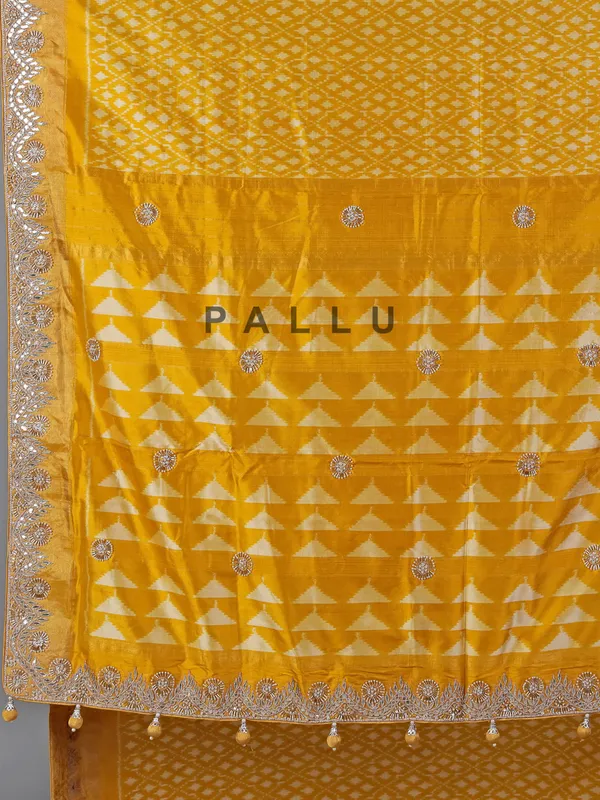 Mustard yellow patola silk saree with beads embellishments