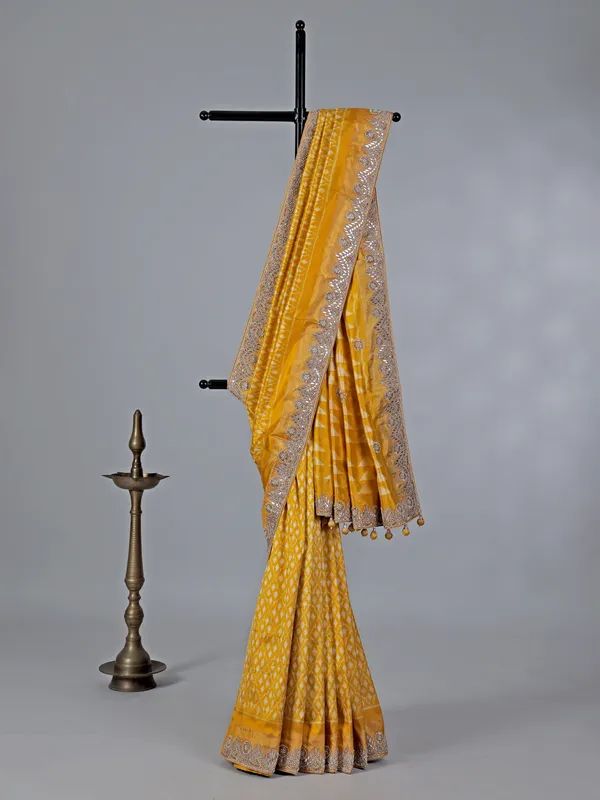 Mustard yellow patola silk saree with beads embellishments
