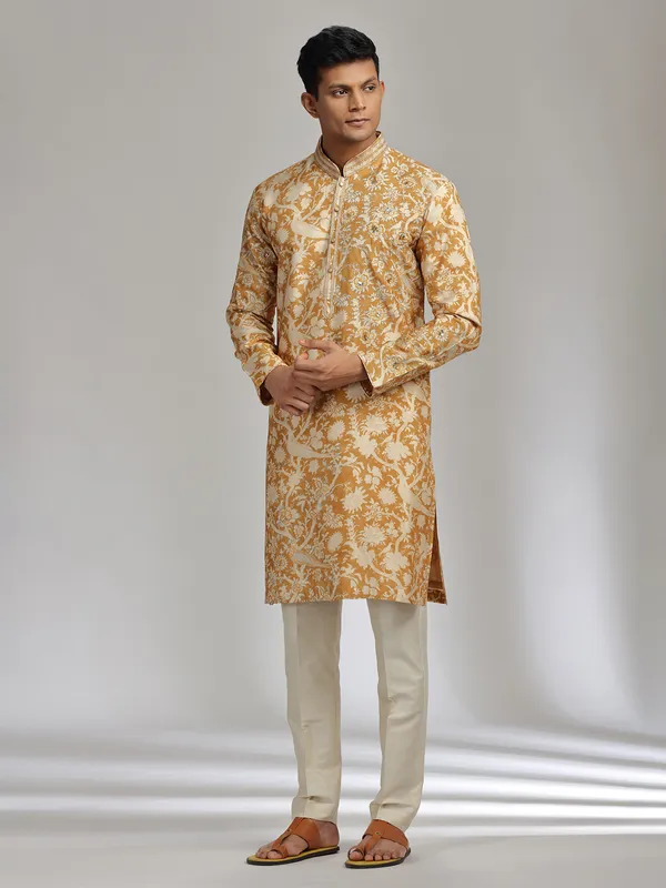 Mustard yellow printed festive wear silk kurta suit