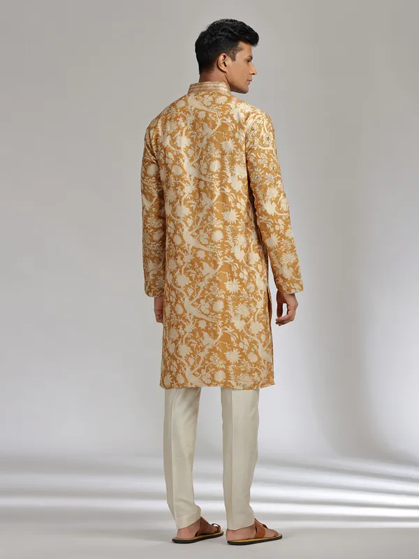 Mustard yellow printed festive wear silk kurta suit
