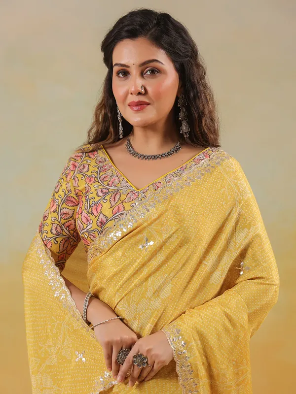 Mustard yellow printed saree in muslin