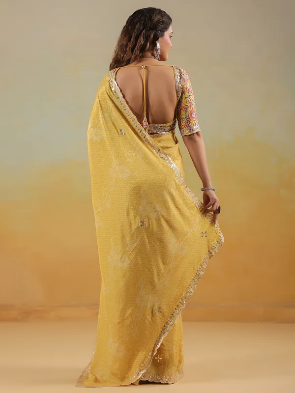 Mustard yellow printed saree in muslin