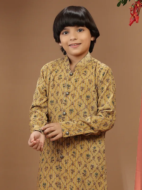 Mustard yellow printed velvet kurta suit for festive