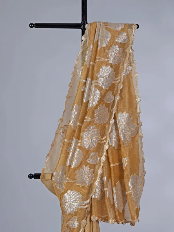 Mustard yellow semi tissue silk saree with zari highlights