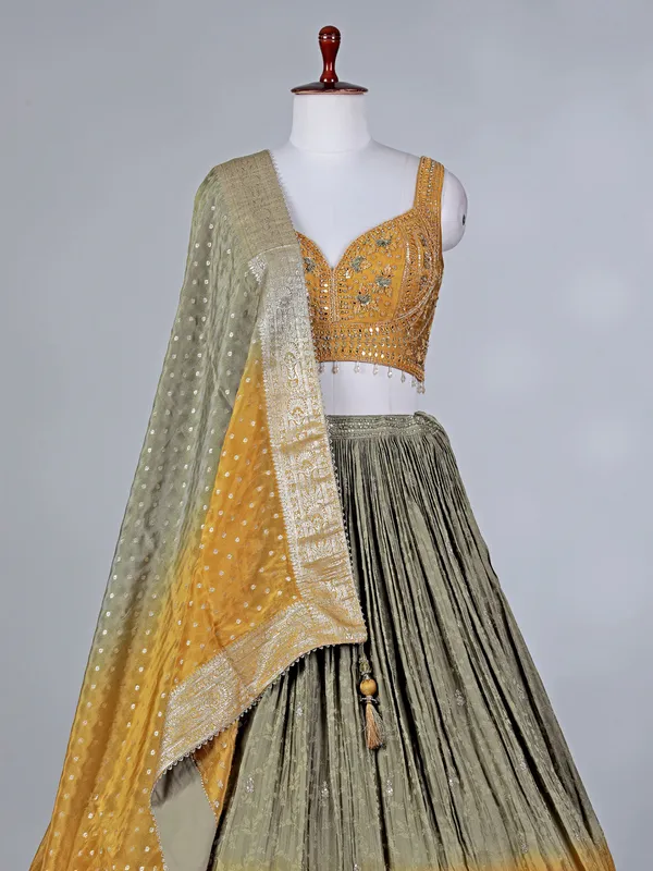 Mustard yellow silk lehenga choli with aabla work