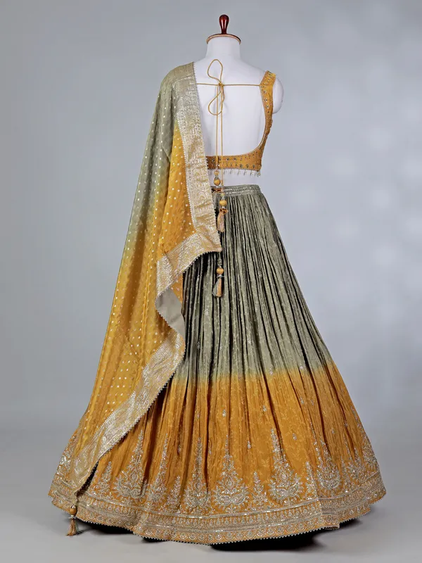 Mustard yellow silk lehenga choli with aabla work