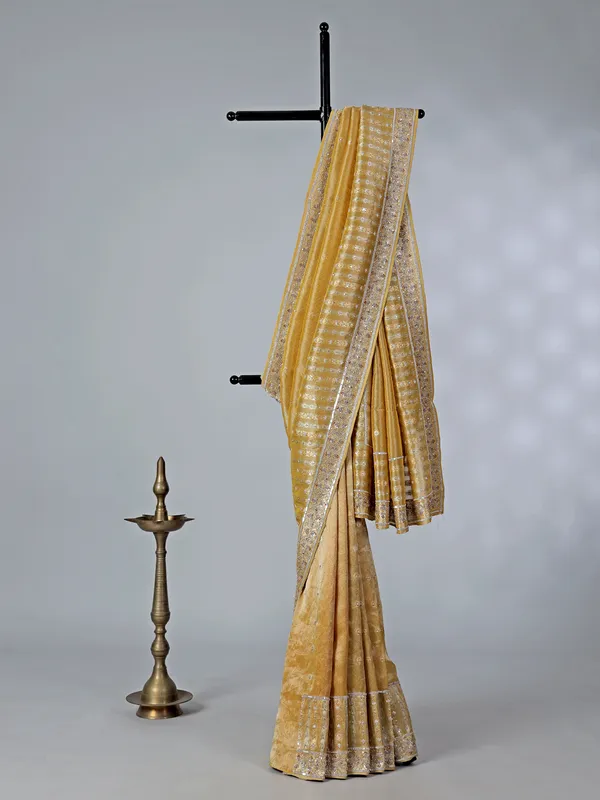 Mustard yellow tissue saree with cutdana work