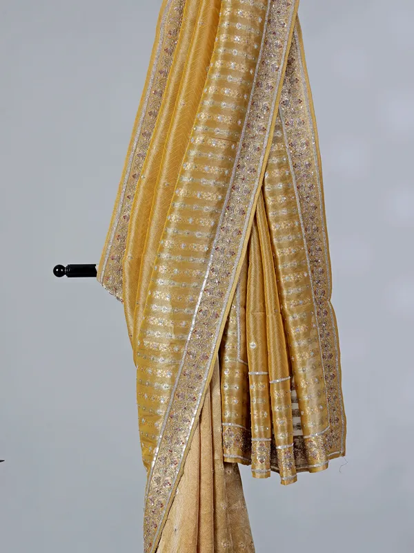 Mustard yellow tissue saree with cutdana work