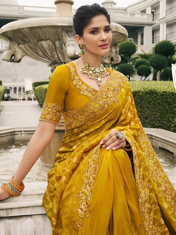 Mustard yellow tissue silk saree for festive flair