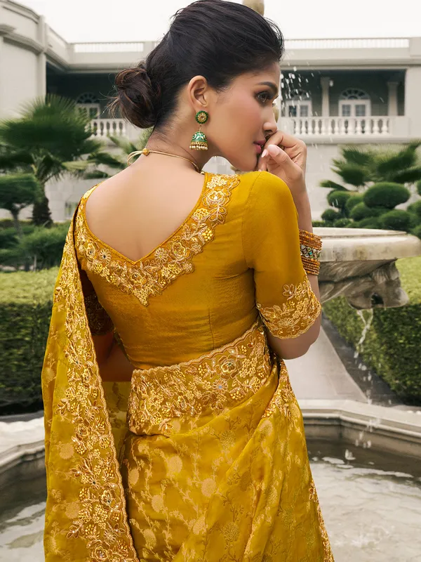 Mustard yellow tissue silk saree for festive flair