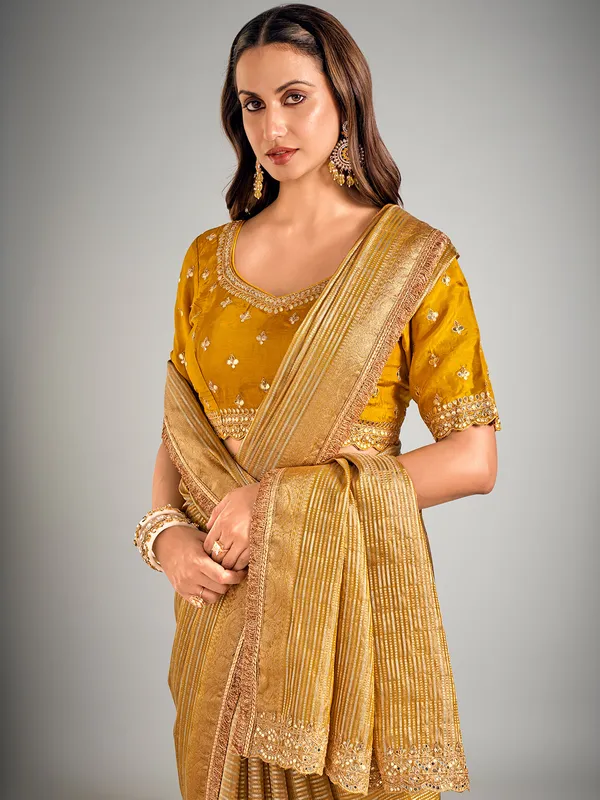 Mustard yellow tissue silk zari weaving saree