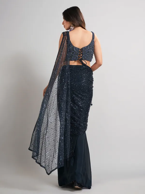 Navy blue party wear saree in lycra andnet with glam detailing