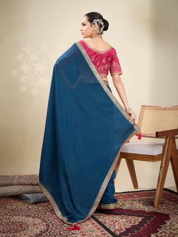 Navy silk plain saree with embellished border