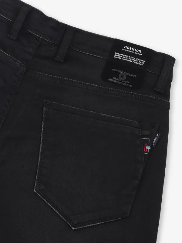 NOSTRUM solid black slim fit denim jeans for men