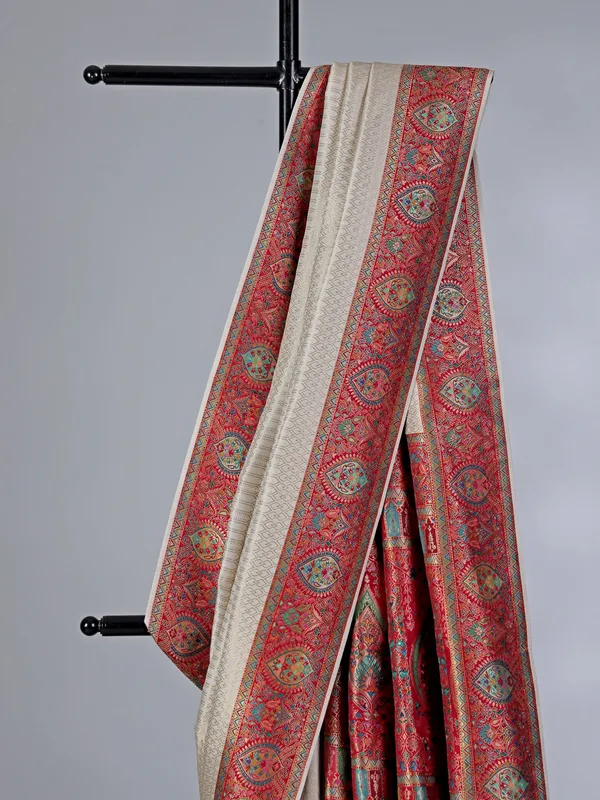 Off white dola silk saree with colorful motifs