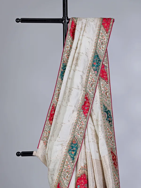 Off white dola silk saree with stone and thread embellishments