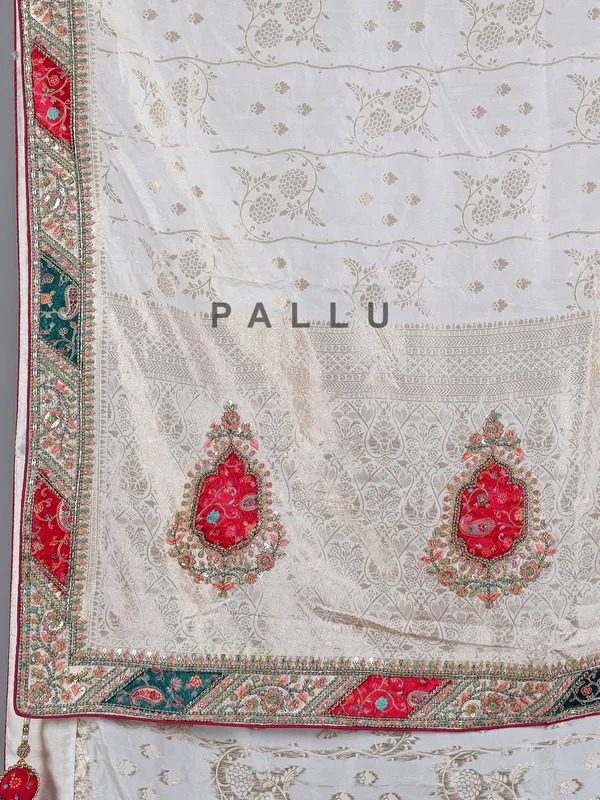 Off white dola silk saree with stone and thread embellishments