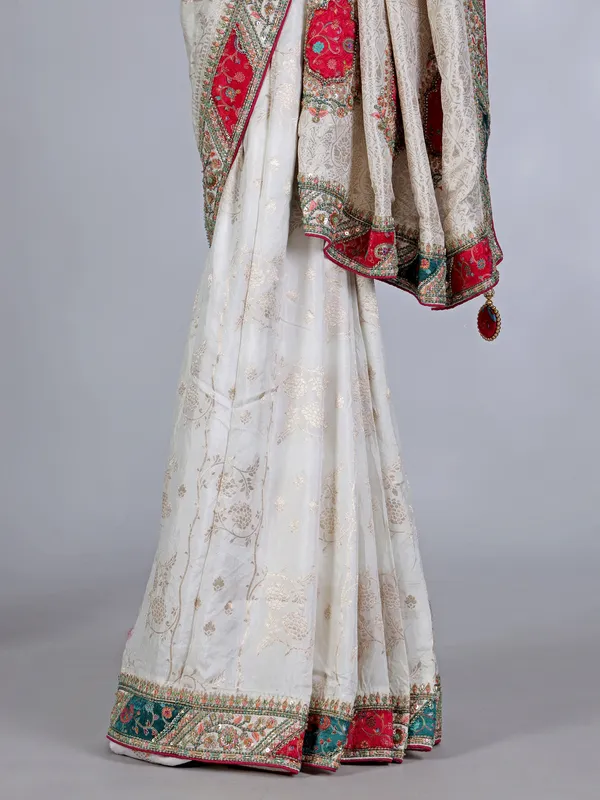 Off white dola silk saree with stone and thread embellishments