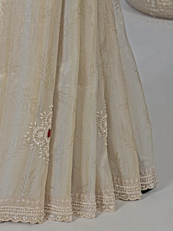 Off white dola tissue silk saree with zari work