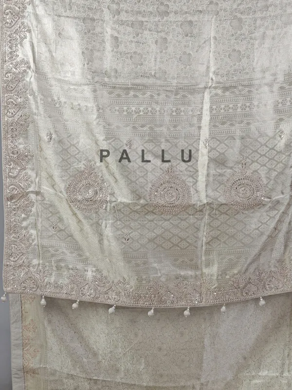 Off white kanjivaram silk saree with zardosi detailing