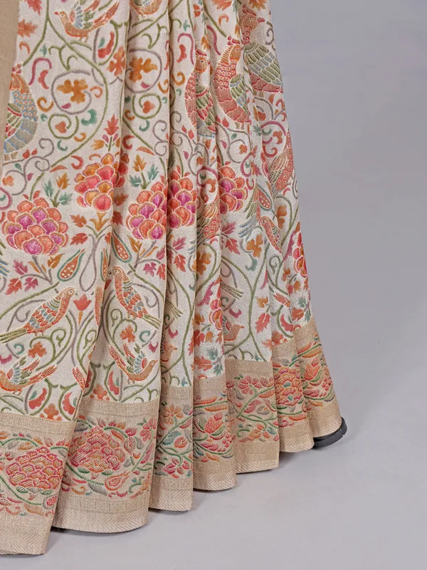 Off white pashmina silk saree with colorful motifs