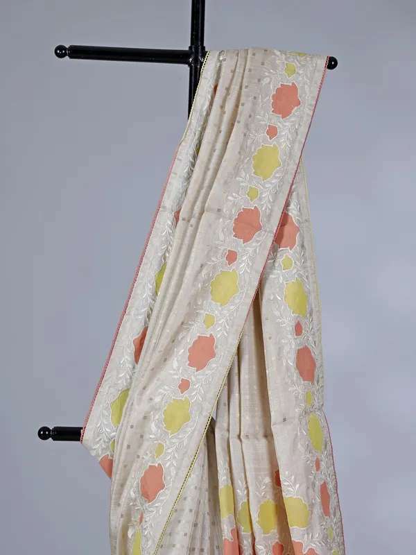 Off white peach semi silk saree with zari and embroidery accents