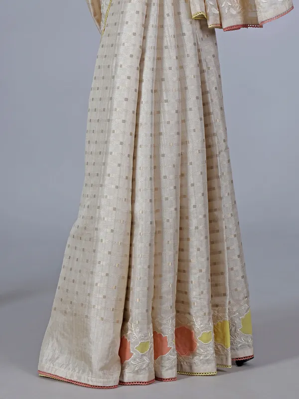 Off white peach semi silk saree with zari and embroidery accents