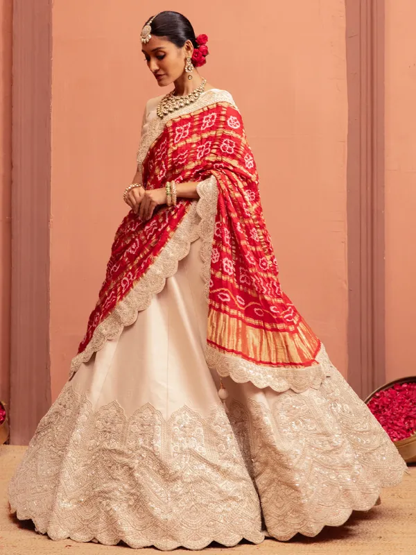Off white raw silk lehenga choli with embellishments