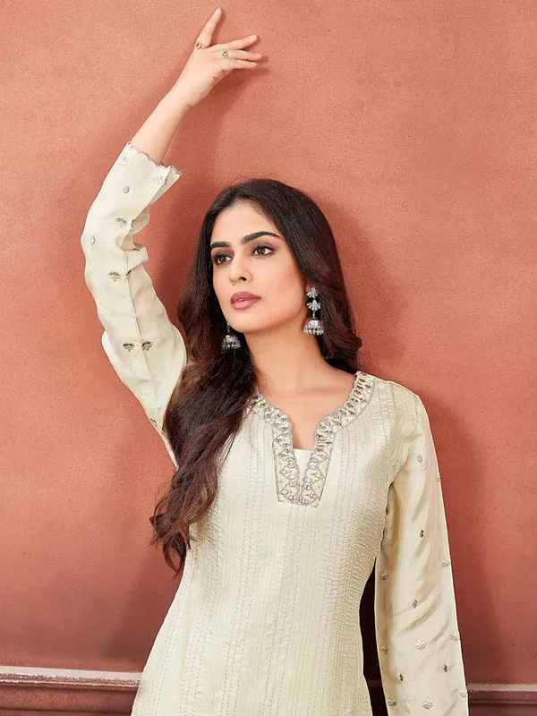 Off-white salwar suit with floral dupatta