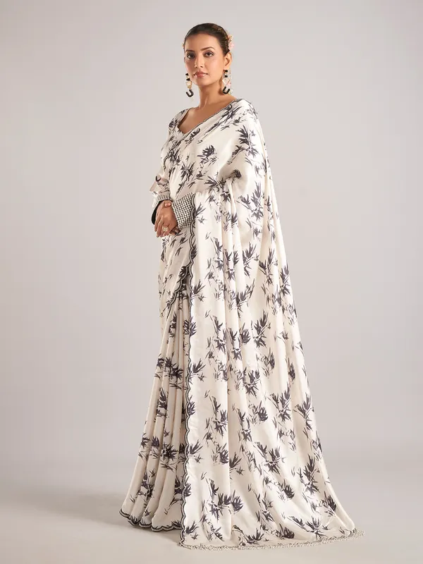 Off white satin saree with cutdana work