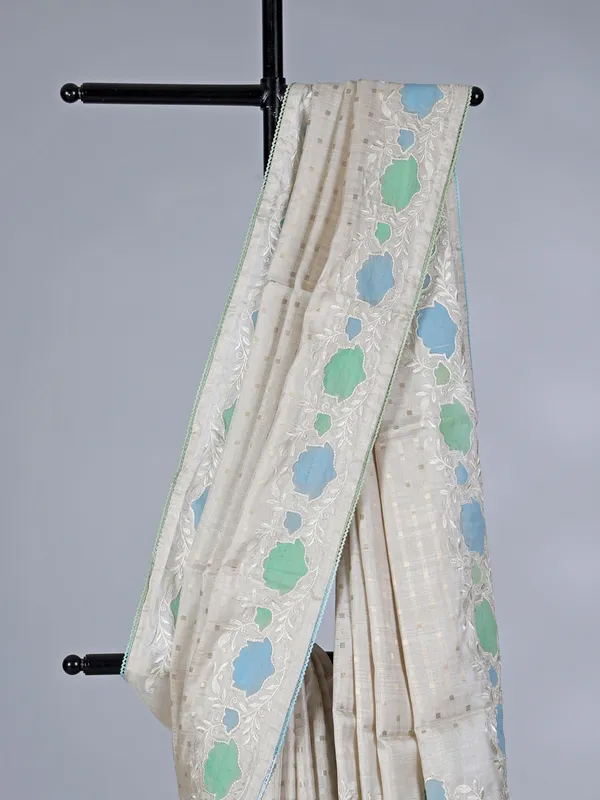 Off white semi silk saree with elegant zari and embroidery work