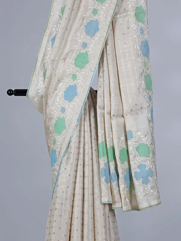 Off white semi silk saree with elegant zari and embroidery work