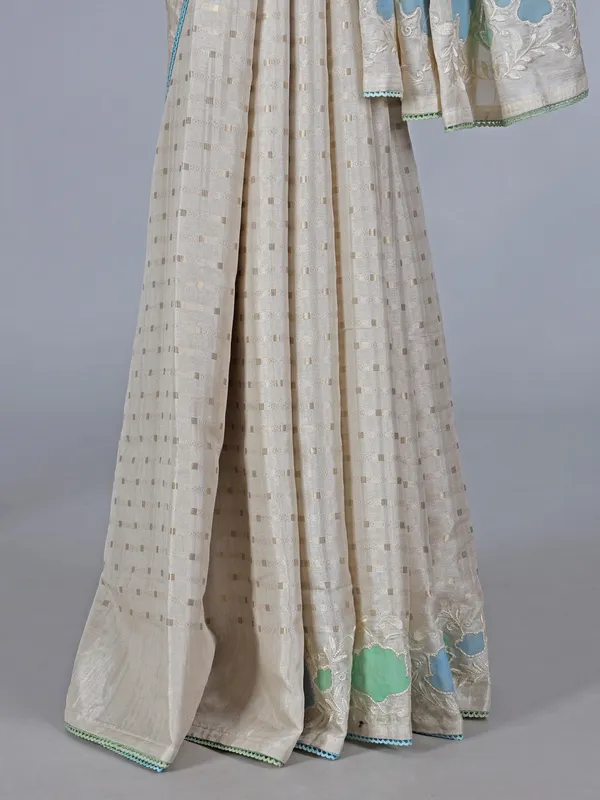 Off white semi silk saree with elegant zari and embroidery work