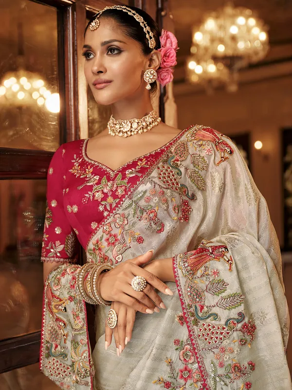 Off white silk festive wear saree with red blouse
