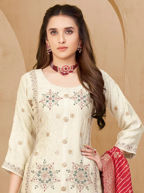 Off white silk salwar suit with zardosi detailing