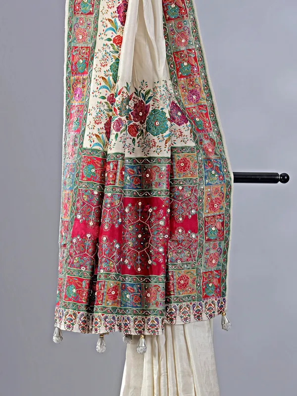 Off white silk saree with beaded detailing