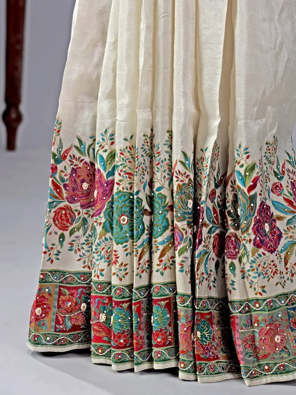 Off white silk saree with beaded detailing